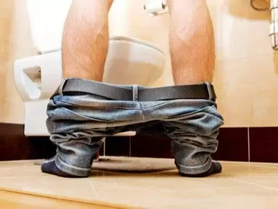 depositphotos_106171598-stock-photo-man-peeing-in-toilet-at